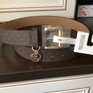 Sold.  Michael kors belt with logo charm